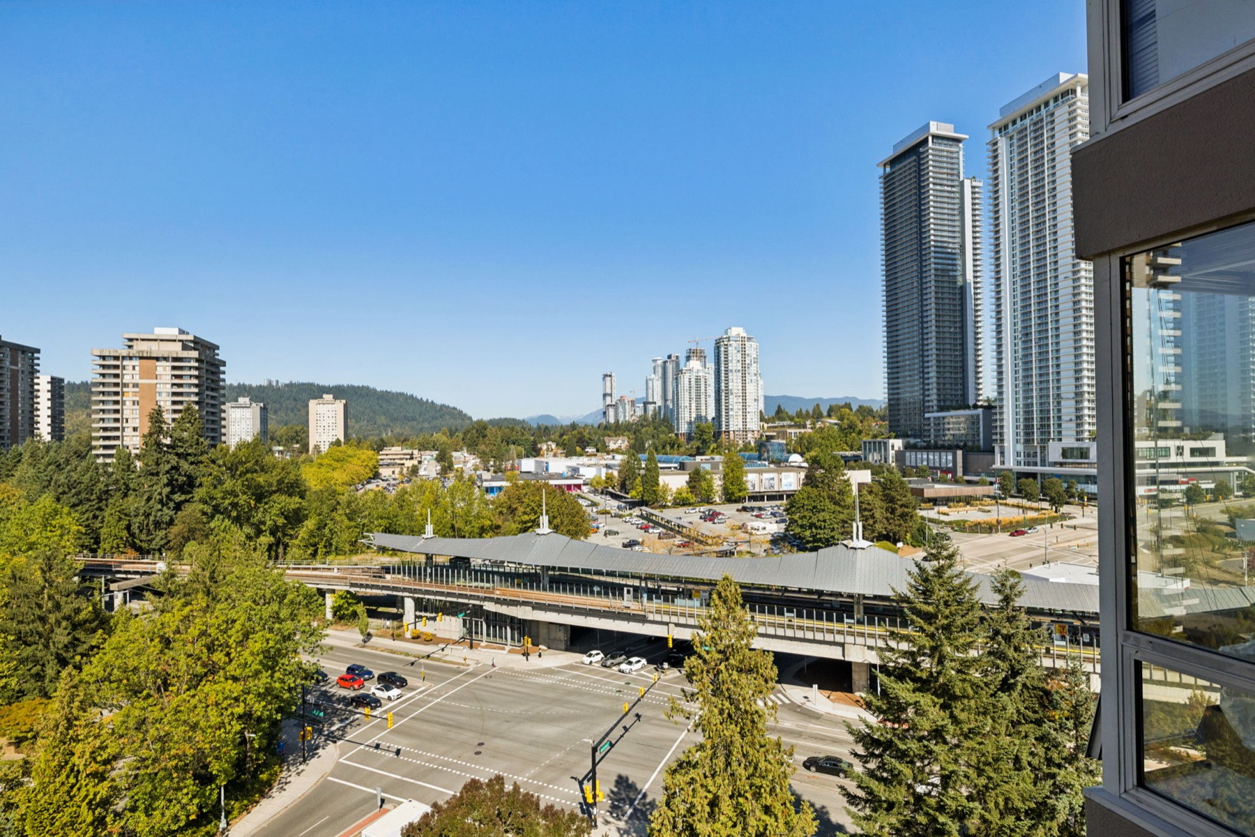 Over the station roof to new towers and the mountains.