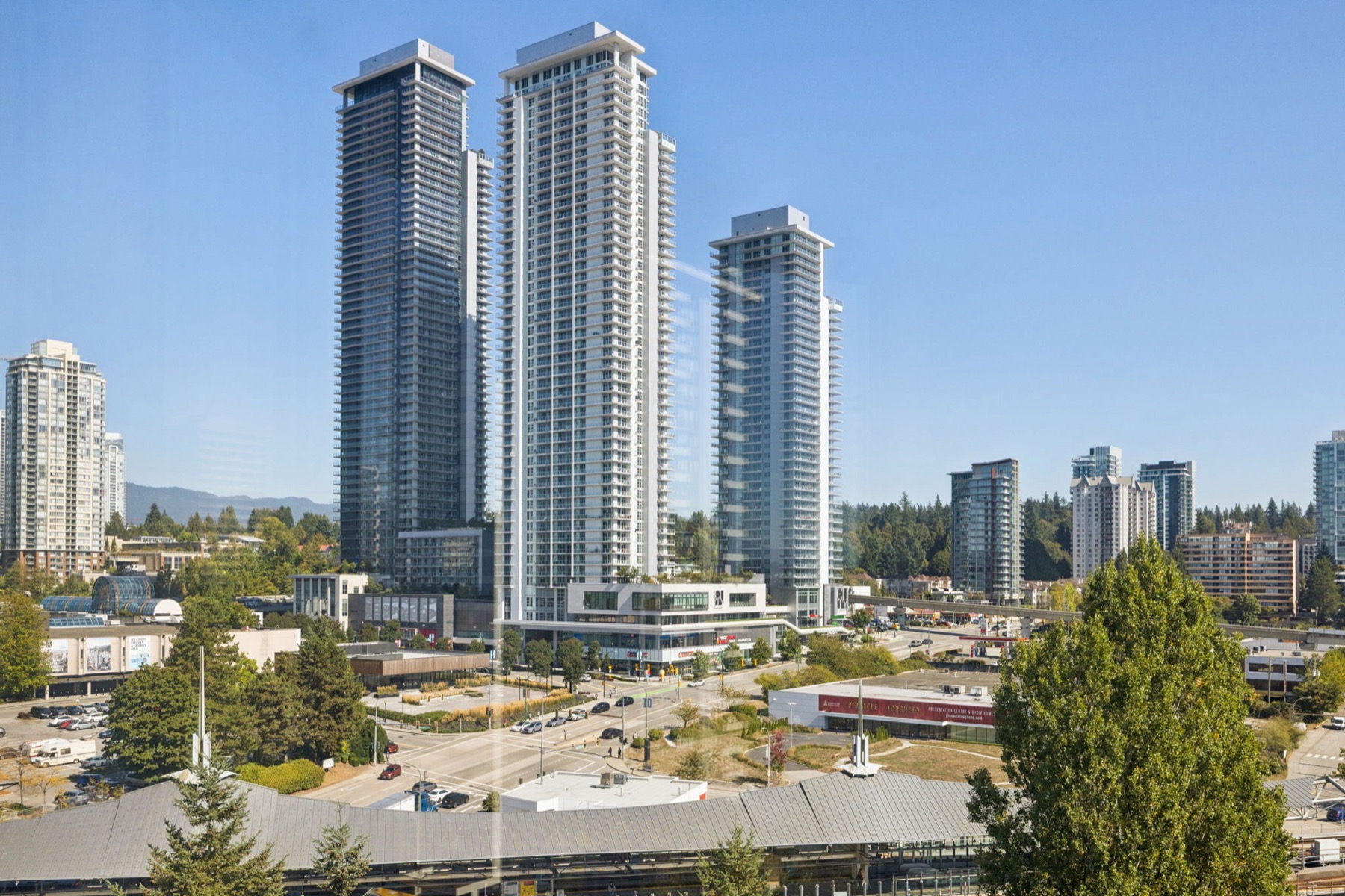 Two new towers above the station, the hills behind them.